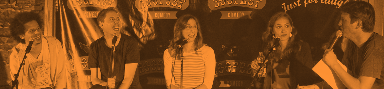 several comedians sit on stage having a conversation at a comedy festival